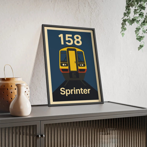 A framed sprinter train poster featuring a stylized yellow and black class 158 sprinter on a navy regional railways background