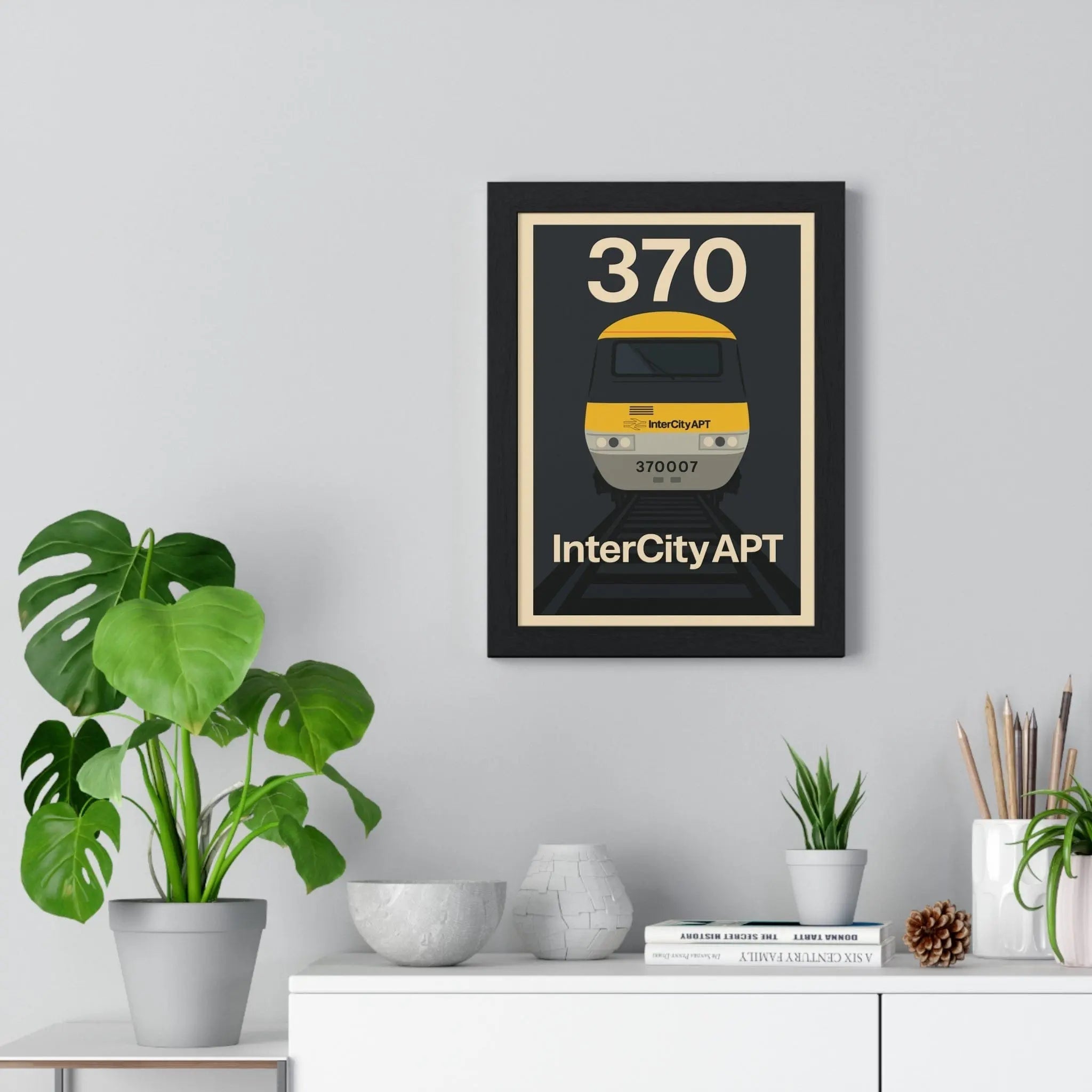 Black-framed apt poster featuring a stylized yellow and gray advanced passenger train with number 370 for wall art