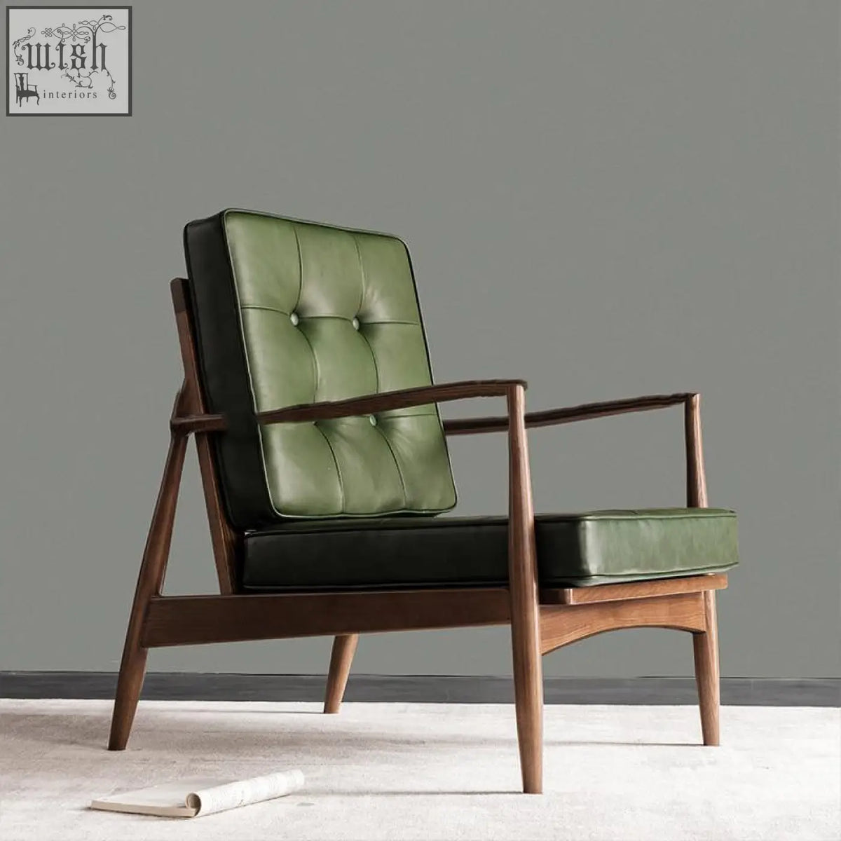 Classic c02 armchair with green leather seat and backrest, black leather trim, and dark wood frame in mid-century style