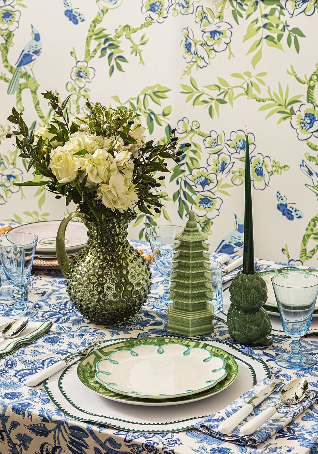 Classic green round placemats set of 4 with a green textured glass pitcher filled with white roses and greenery