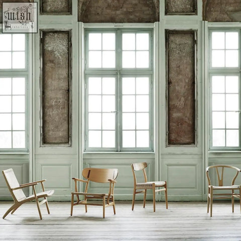 Four classic hans w ch01 rattan dining chairs in light oak with woven seats in a bright minimalist room