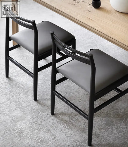 Classic itao dining chair with black wooden frame and upholstered gray seat perfect for stylish dining setups