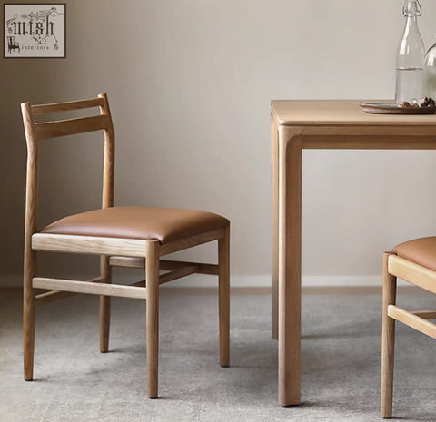 Classic itao dining chair in oak features minimalist wooden frame with tan leather seat and backrest for dining use