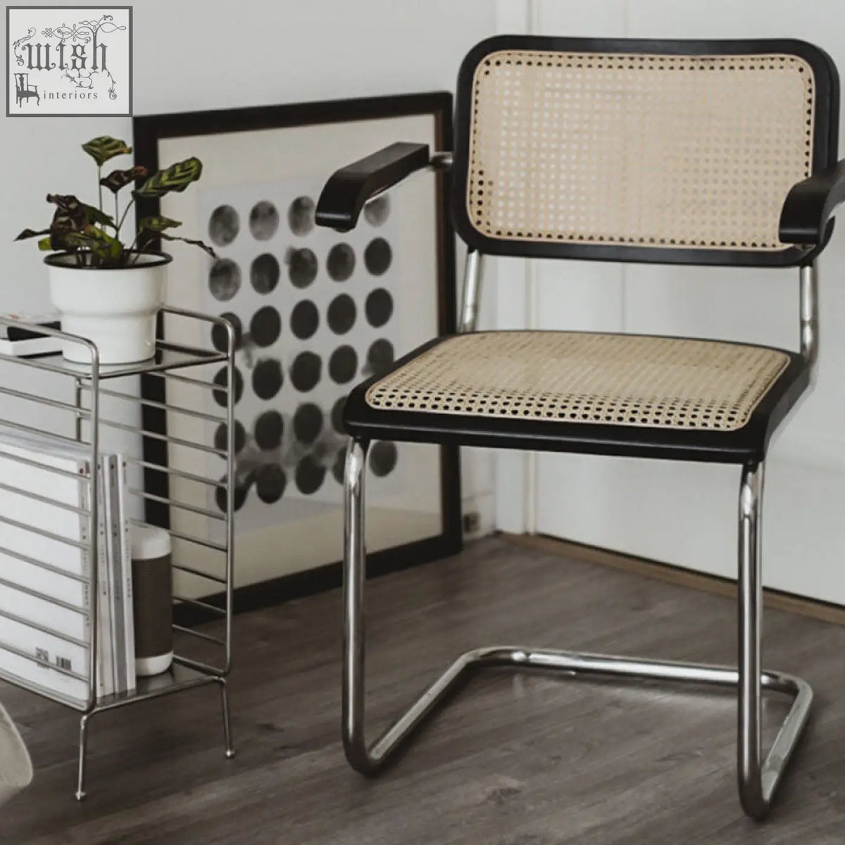 Classic keaton rattan dining chair with black-framed cane seat and sleek chrome tubular base perfect for dining rooms