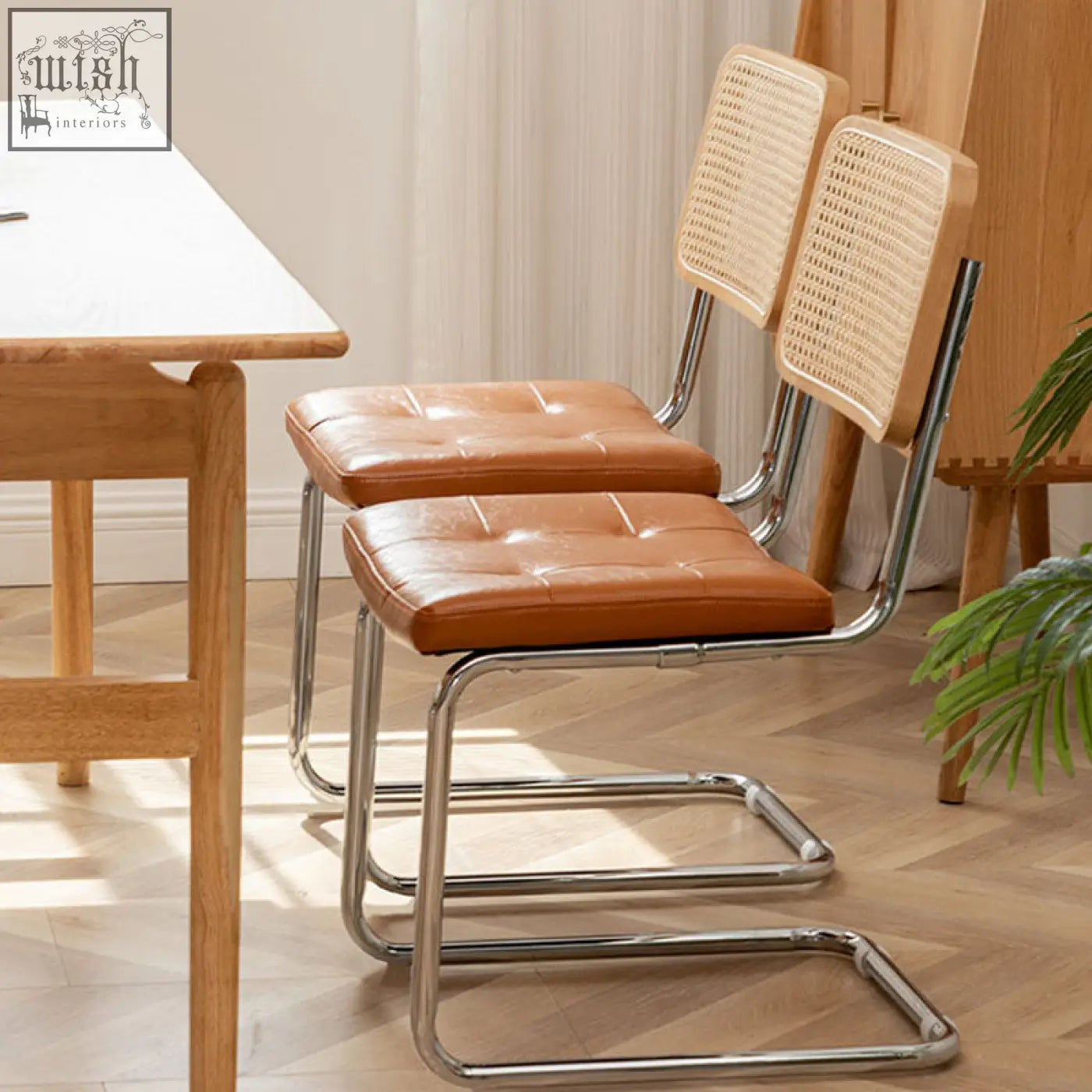 Classic keaton rattan dining chair with brown leather tufted seat woven cane backrest and chrome cantilever frame