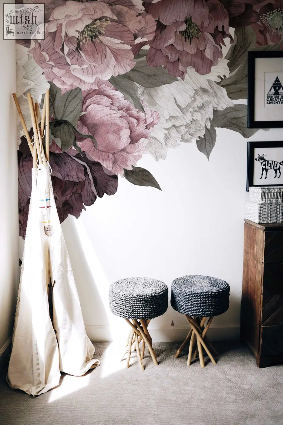 Classic peonies removable wallpaper with floral peony design displayed above two gray woven stools with wooden legs in living space