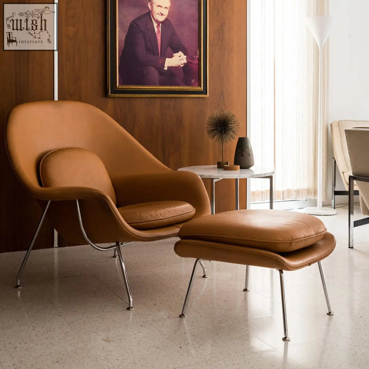 Warm tan leather classic womb chair with sleek chrome legs and matching ottoman in premium velvet or linen sky blue
