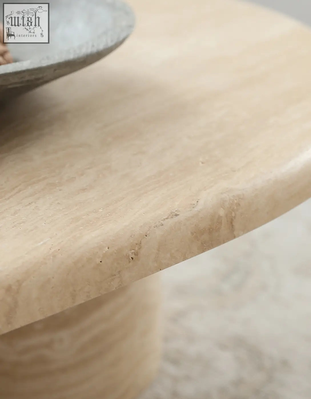Beige marble oval coffee table clio art deco with smooth polished surface and subtle natural veining and smooth curves