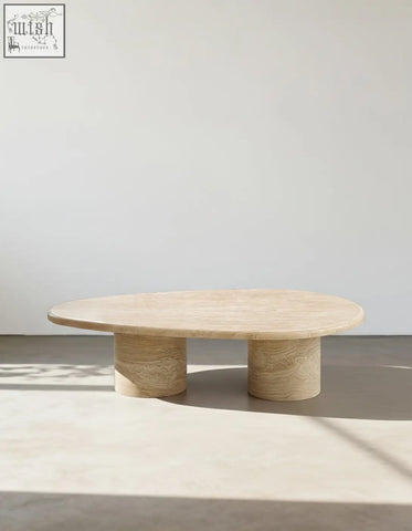 Cream-colored marble oval coffee table clio art deco with smooth curves and two cylindrical legs