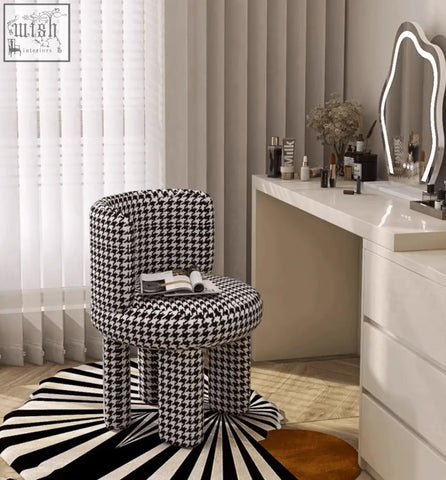 Cloud dressing stool with black and white houndstooth fabric and rounded backrest on four tapered legs