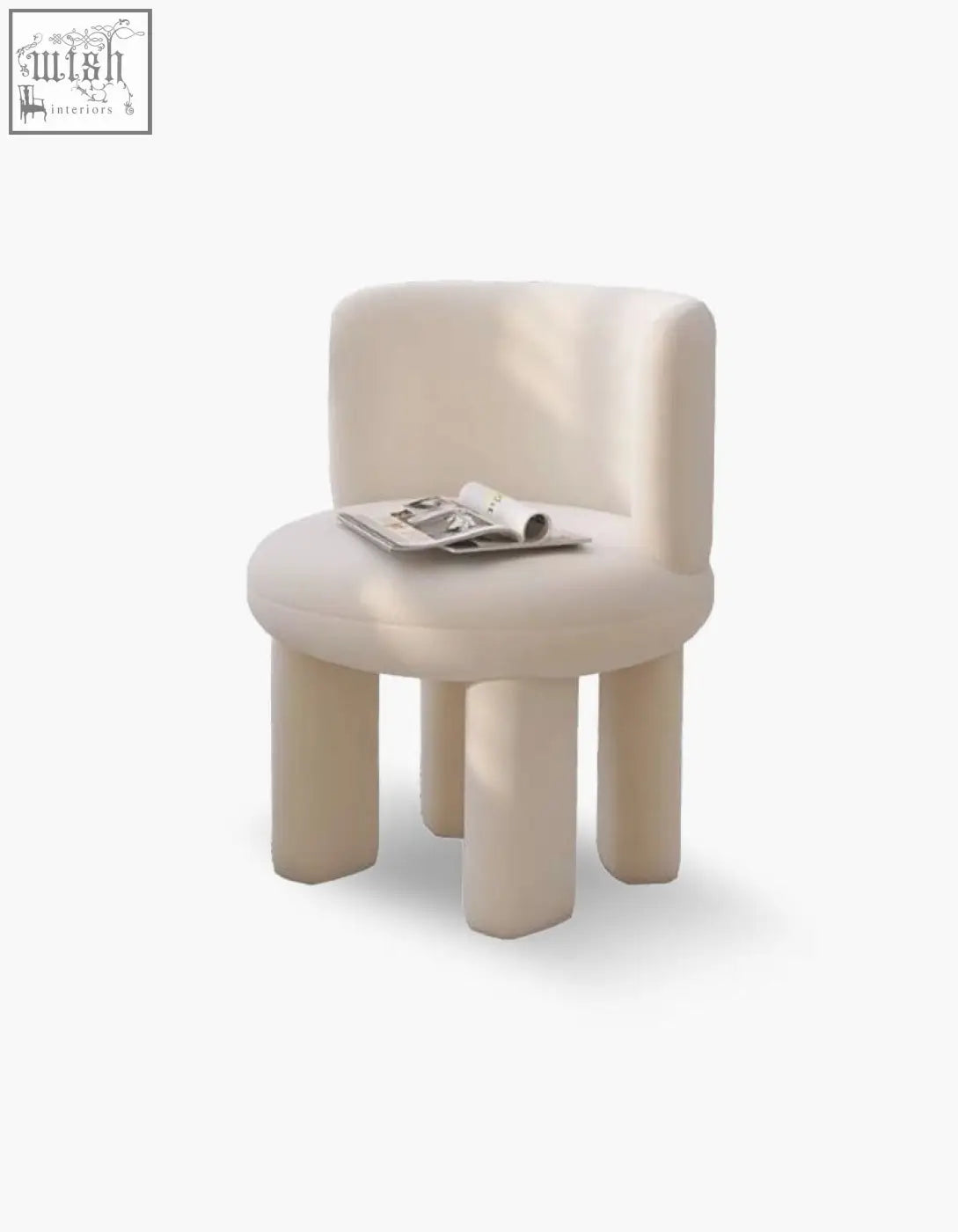 Cream-colored upholstered cloud dressing stool with rounded minimalist design and thick cylindrical legs