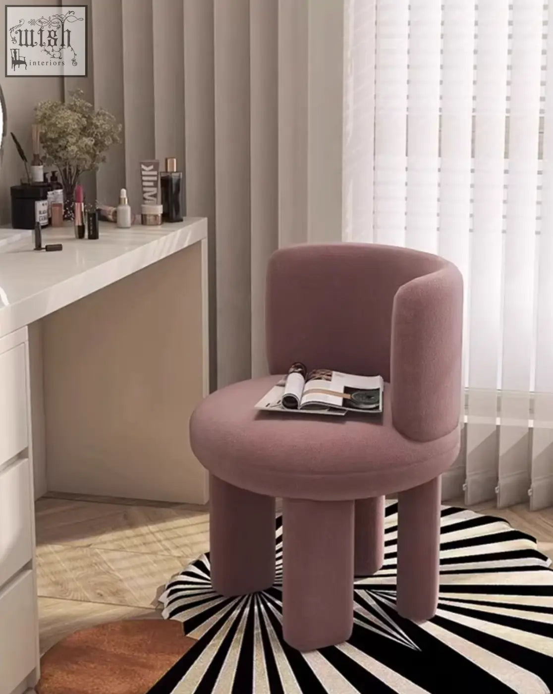 A soft mauve velvet cloud dressing stool with rounded cylindrical legs and a cushioned seat for comfy seating