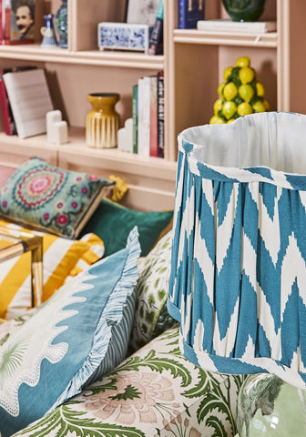 Coastal cabana cushion cover with teal and white ikat pattern and pleated design perfect for beachy vibes