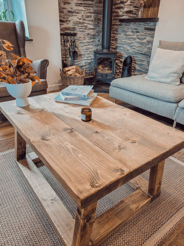 Rustic light brown wooden coffee table with visible grain and sturdy construction pictured coav rustic coffee table