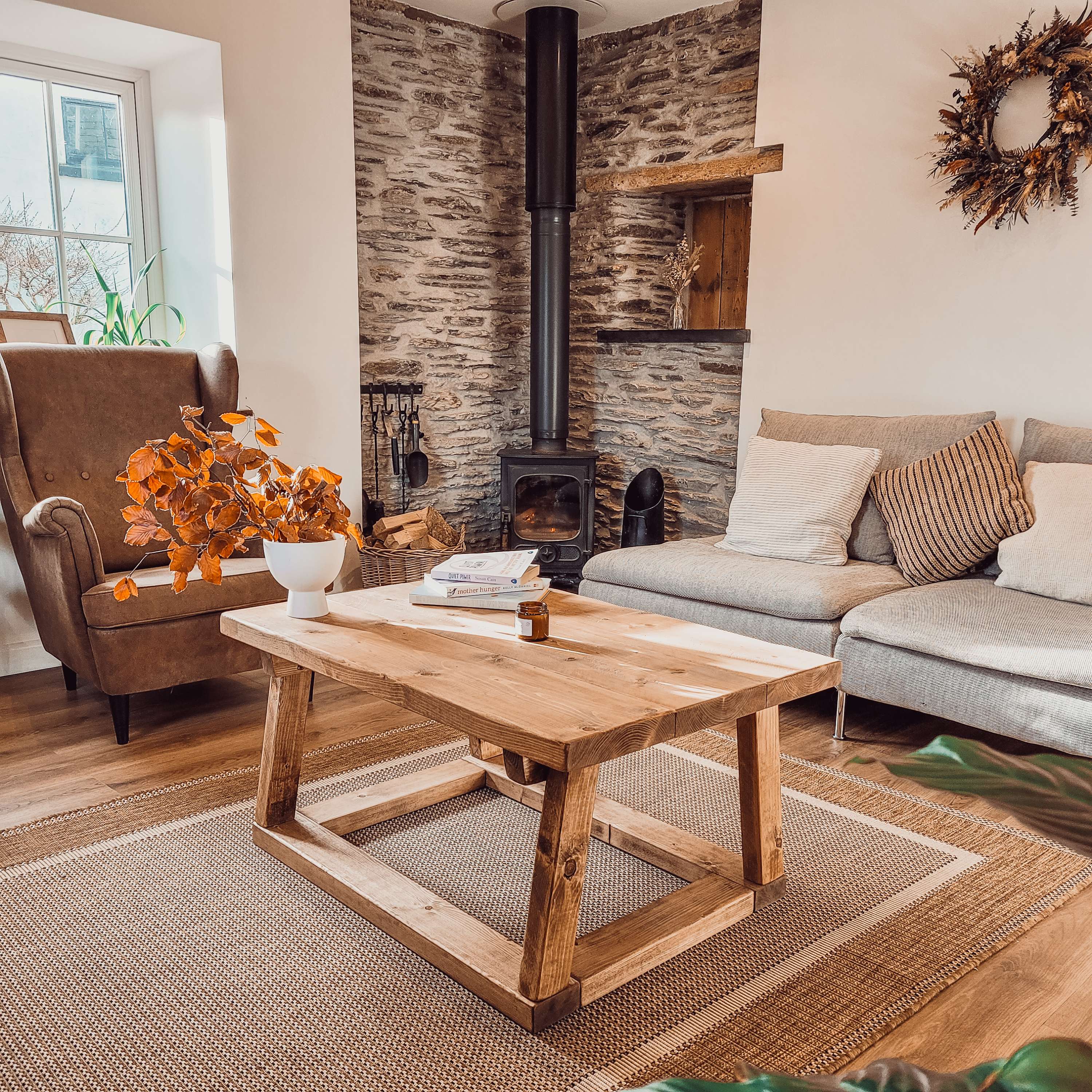 Pictured coav rustic wooden coffee table with sturdy frame and visible grain perfect for living room use