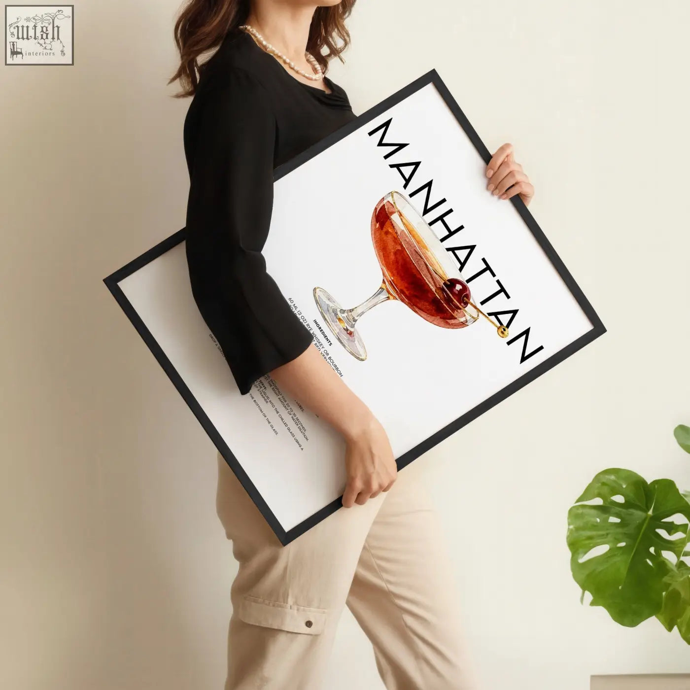Black-framed bar wall art featuring a vibrant manhattan cocktail illustration with bold black typography print