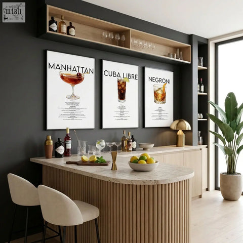 Three framed cocktail recipe prints manhattan cuba libre and negroni as stylish bar wall art on dark wall above bar