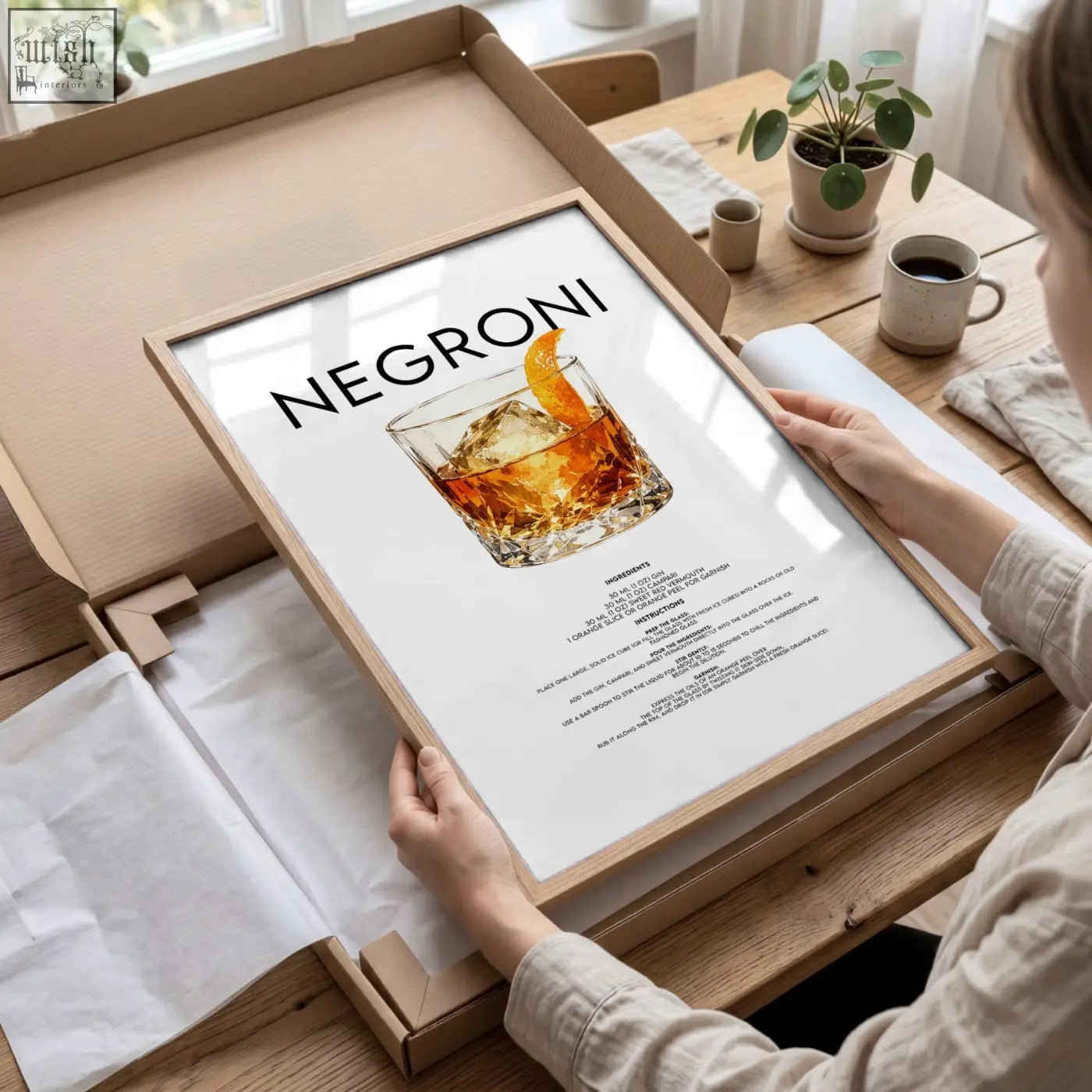Framed bar wall art poster featuring a negroni cocktail illustration in an ornate glass with ice and orange twist