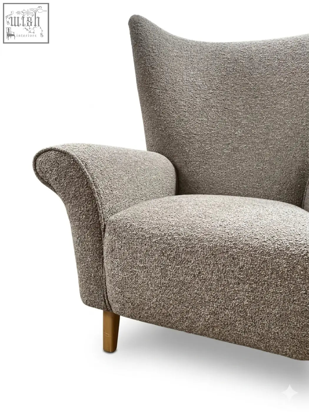 Cozy textured gray coco wing chair with high back and wooden legs perfect for relaxing at home