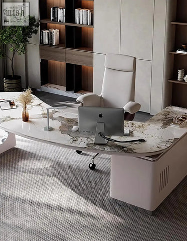 Modern white leather executive chair with high back and adjustable armrests next to coelho corner office desk with sintered stone
