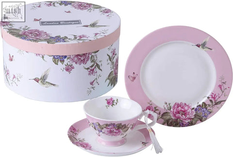Pink and white porcelain teacup with floral design in a shabby chic gift box with dessert plate set and hummingbirds