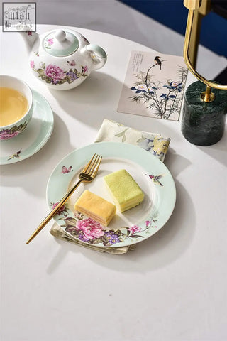 A delicate turquoise porcelain dessert plate set with mint green base floral bird butterfly design gift box included