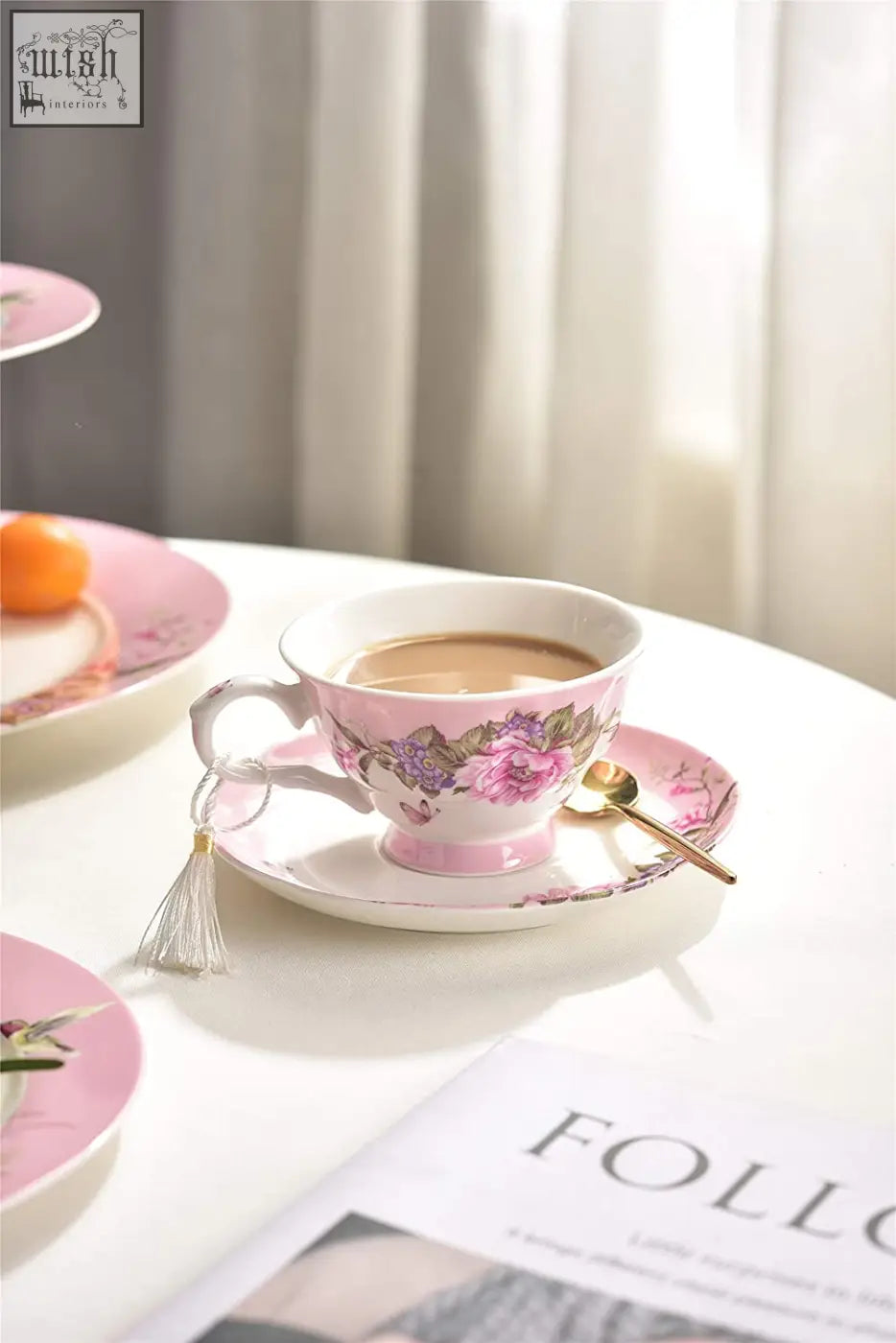 Pink porcelain tea cup with floral design on matching saucer in shabby chic dessert plate set with gift box