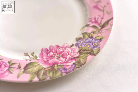 Delicate pink ceramic dessert plate set with vibrant floral pattern included in shabby chic gift box
