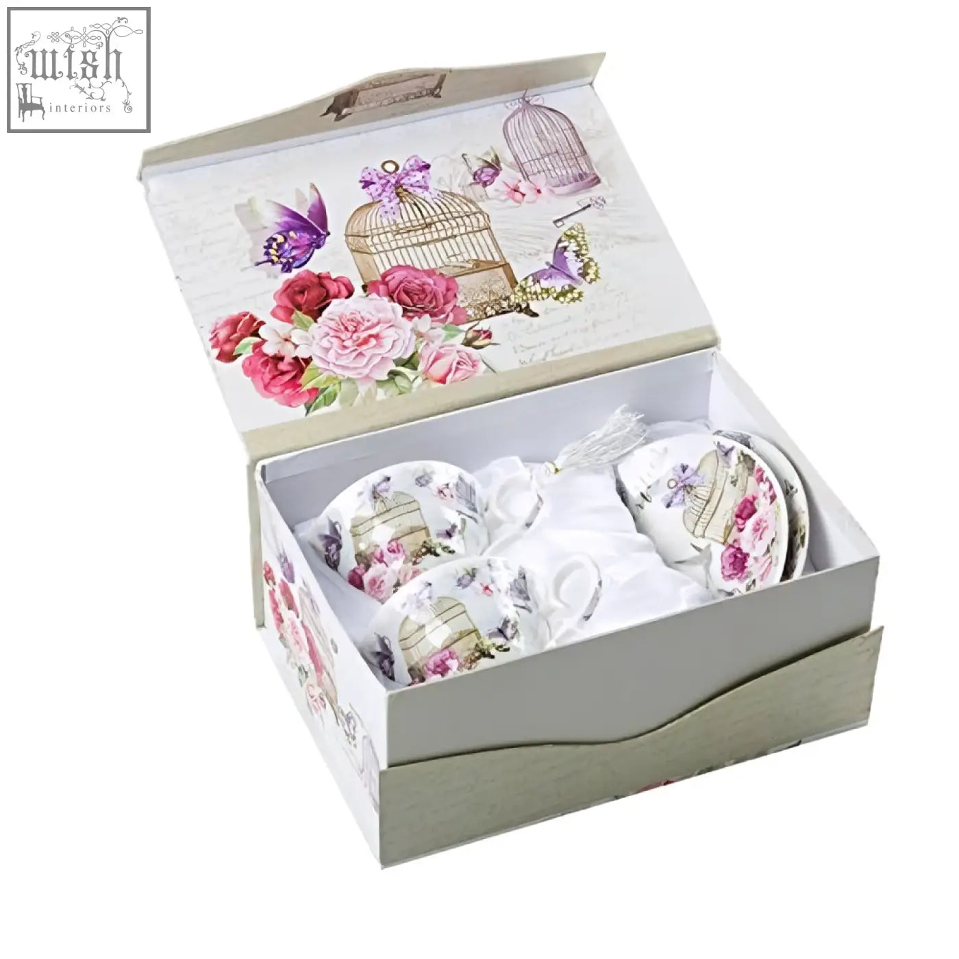 A delicate porcelain coffee tea cup and saucers set with pink roses and gold birdcages in a lalic summer garden gift box