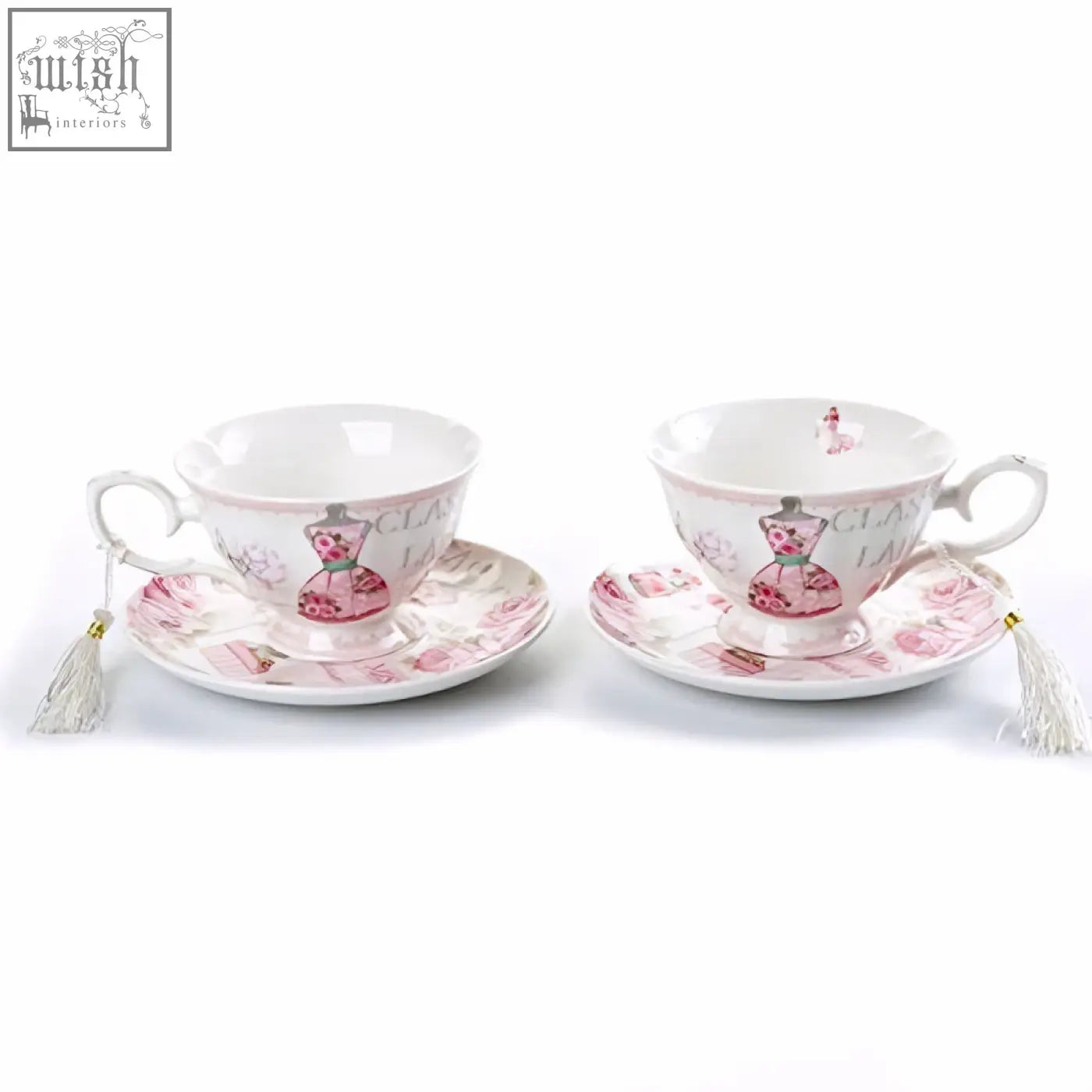 A pair of white ceramic coffee tea cups and saucers set with pink classic lady designs and delicate tassels in a gift box
