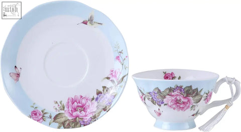 Pastel blue porcelain coffee tea cup and saucer set decorated with birds butterflies in a beautiful gift box