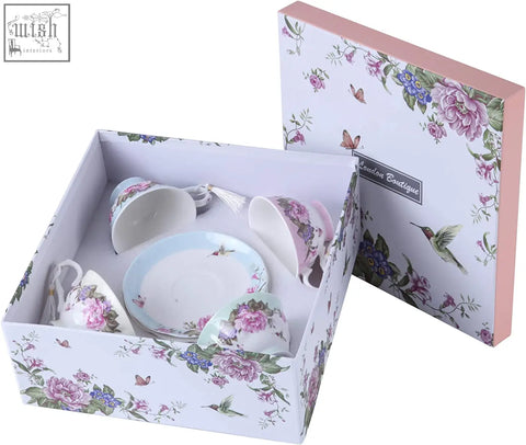 Delicate porcelain coffee tea cup and saucers set with pink floral patterns in a beautiful gift box with birds and butterflies