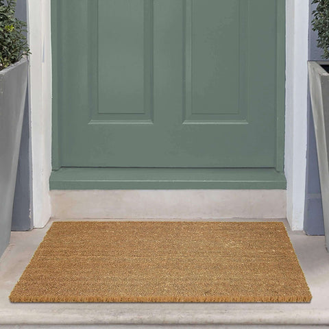 Natural fiber coir solid design mat with light brown textured surface and frayed edges perfect for entryways