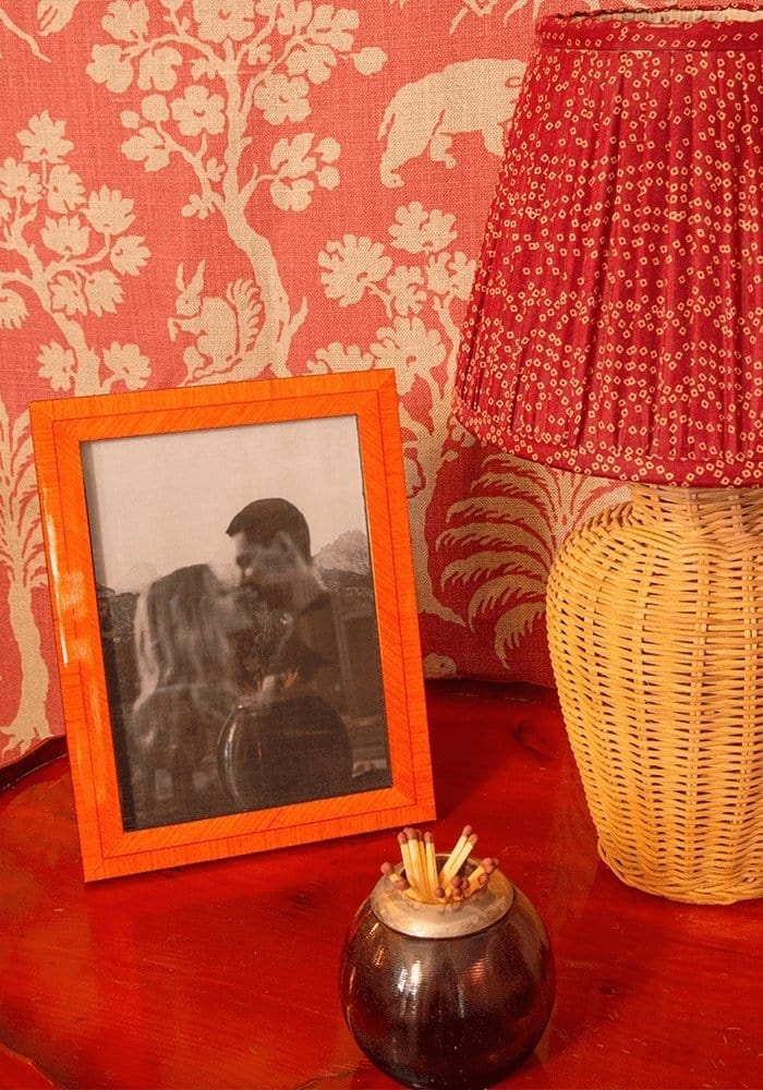 Orange framed colonna marquetry frame 6x4 displaying a black and white photo of a couple kissing in a marquetry frame