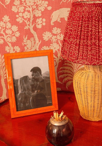 Orange framed black and white photo of couple kissing in colonna marquetry frame 7x5 with stylish marquetry frame design