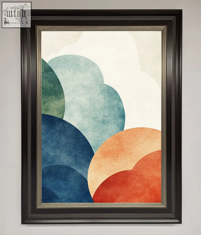 A modern colour clouds framed wall art with overlapping teal, blue, orange, and red circles in a dark brown frame with silver border