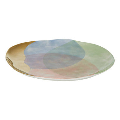 A sleek oval ceramic paradise dinner plate with a pastel mint green peach and lavender gradient finish