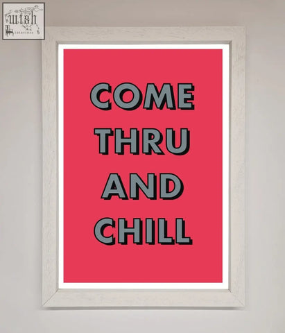 A chill framed poster with bold black come thru and chill text on vibrant pink background in a white wooden frame