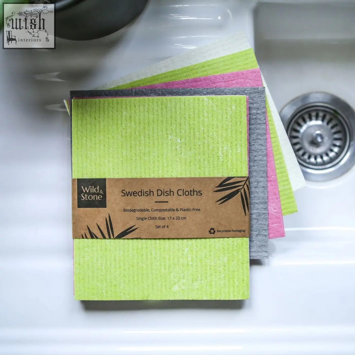Set of four compostable swedish dish cloths in lime green pink and gray with wild & stone kraft label packaging