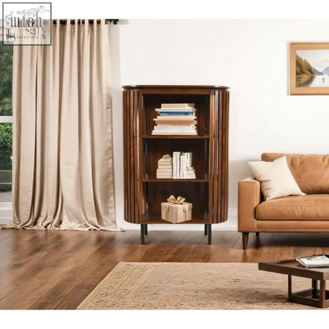 Dark wood compton mango wood bookcase with vertical slats and circular metal legs for stylish storage