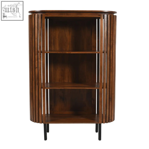 A sleek dark brown compton mango wood bookcase with vertical slats and black circular metal legs