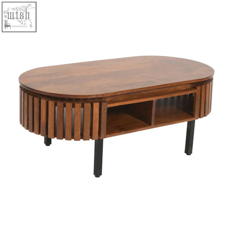 Brown oval compton mango wood coffee table with vertical slats and black round metal legs for living room use