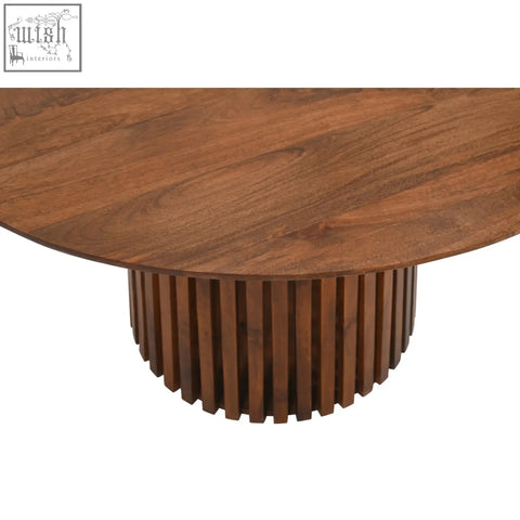 Round walnut coffee table with sleek fluted base made from solid mango wood perfect for dining table setup