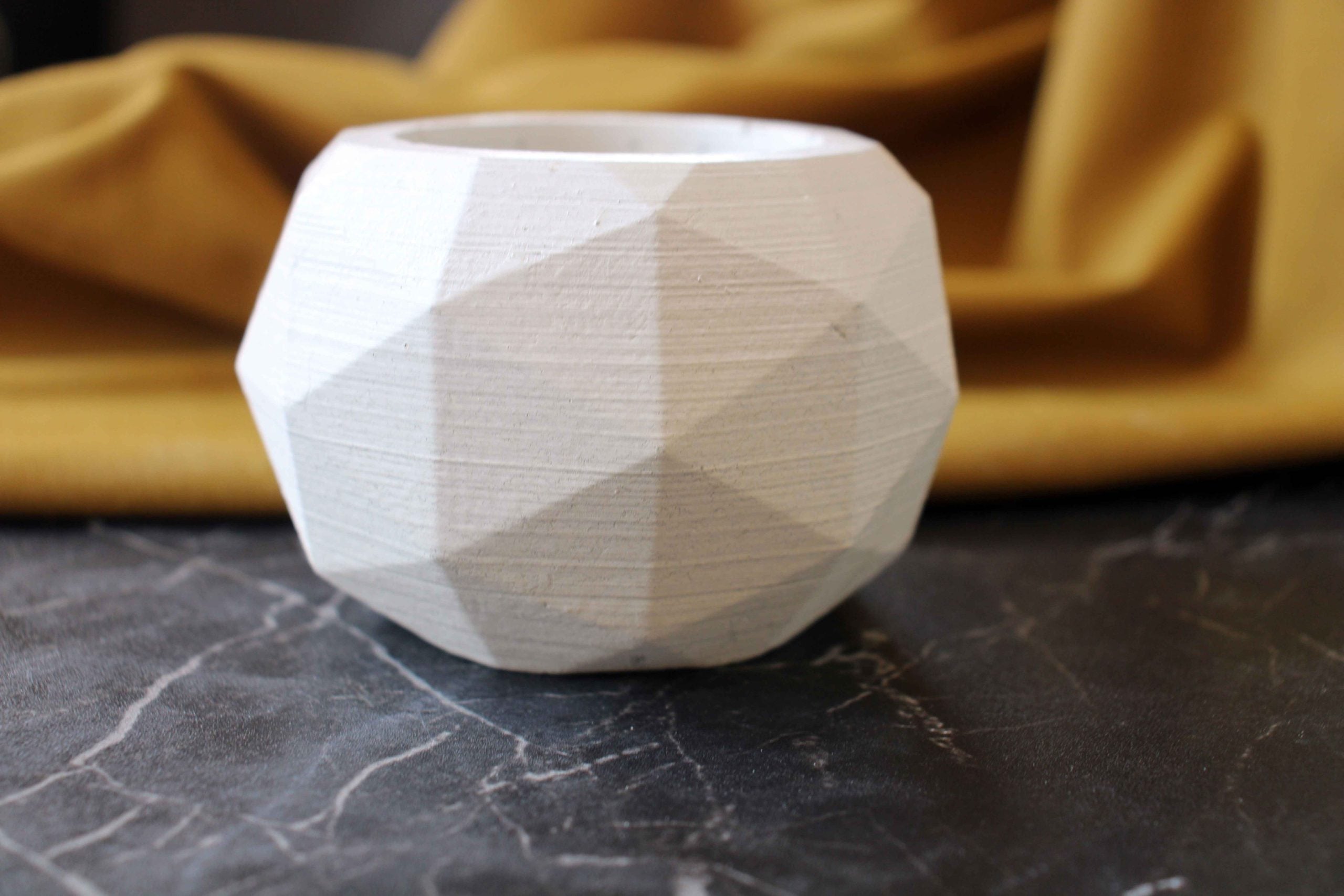 White high quality concrete diagonal pot with faceted angular design and geometric style planter