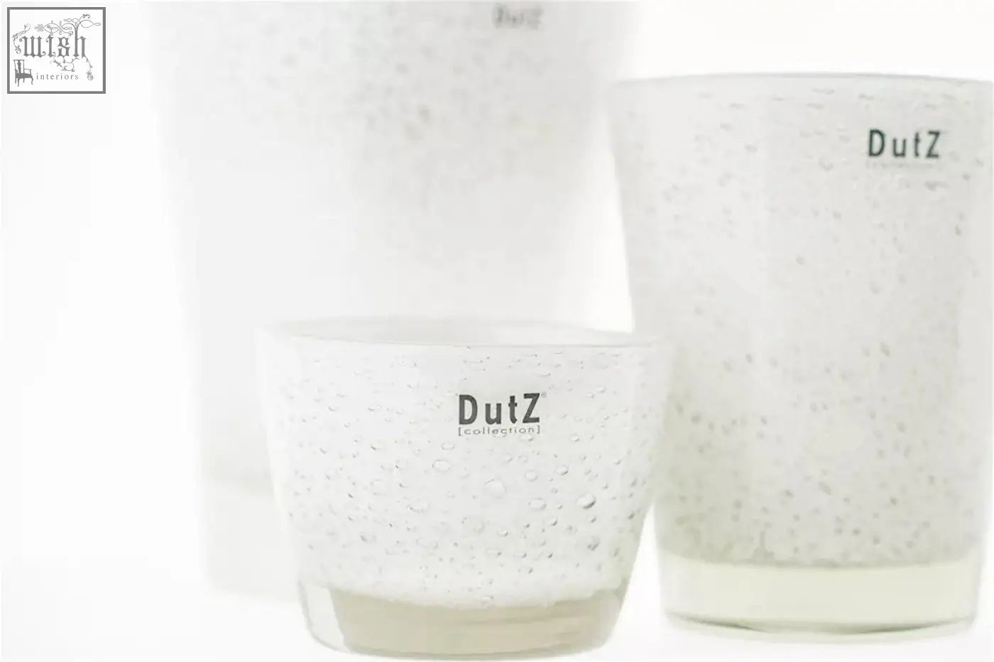 Clear glass conic vase from dutz collection with textured speckled mouth blown glass and dutz branding on each holder