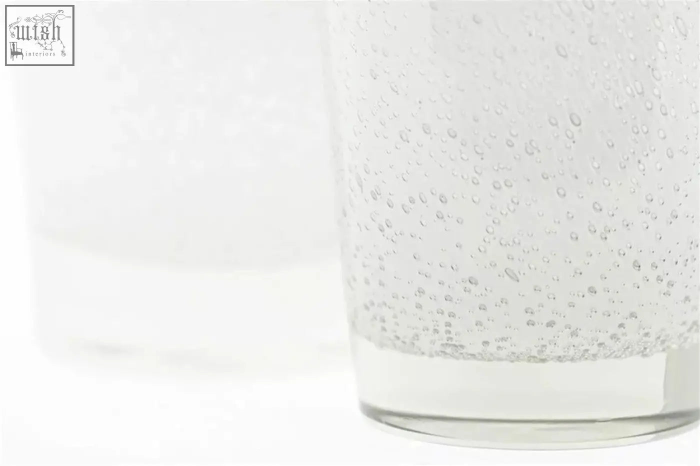 Clear glass conic vase from the dutz collection with thick mouth blown glass and visible bubbles inside