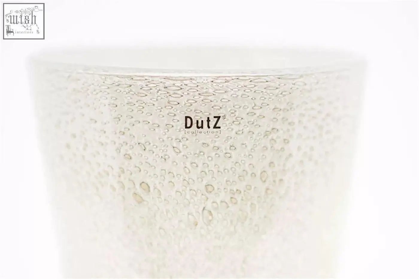 A translucent white mouth blown glass conic vase with textured bubbles and dutz collection logo printed in black