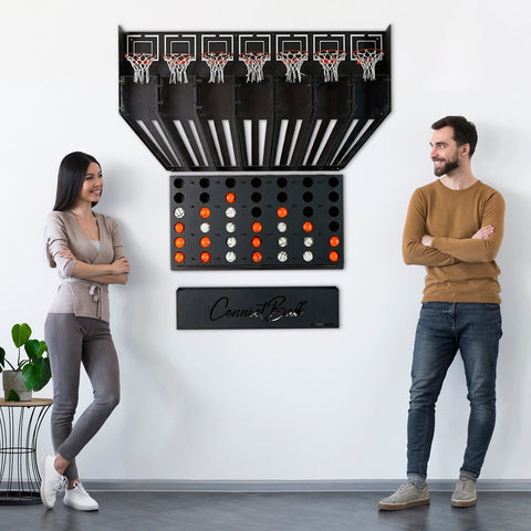 Black metal wall-mounted connect balls game with five hoops and a grid of orange and white four balls below the central piece