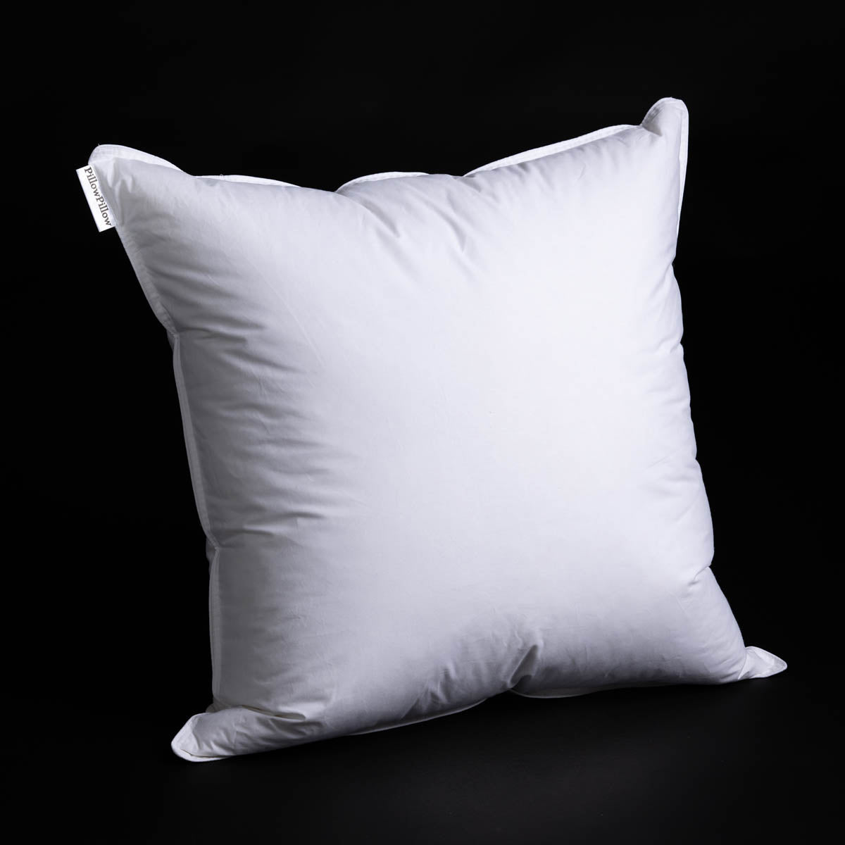 Continental the big square one white duck pillow with smooth slightly wrinkled fabric and small corner tag