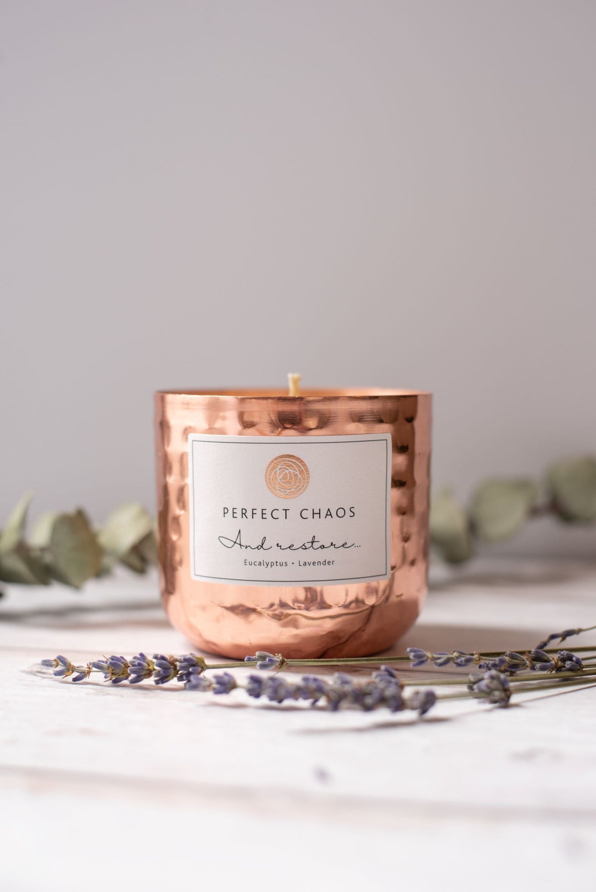 Copper dimpled candle jar with hammered metal finish scented with eucalyptus and lavender essential oils for and restore